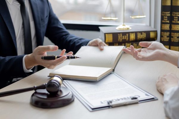 Attorney or judge provides legal advice to the client in the courtroom, Ethics in the courts include justice and impartiality, legal consultant, scales of justice, law hammer, Litigation and justice.